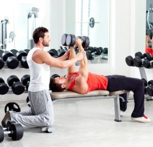 gym personal trainer man with weight training